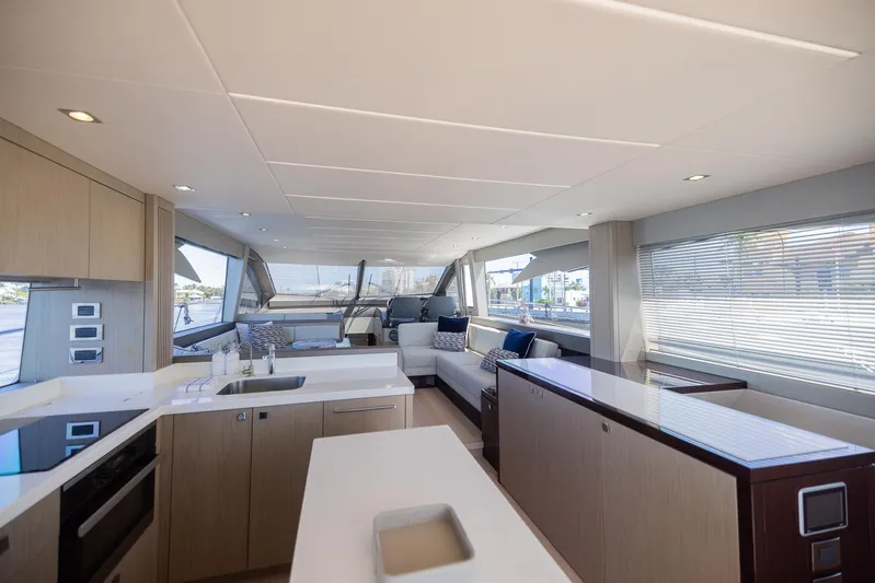 Sea Zar Yacht Photos Pics Luxurious interior of 2019 Sunseeker Manhattan 66 yacht with modern kitchen and spacious seating area.