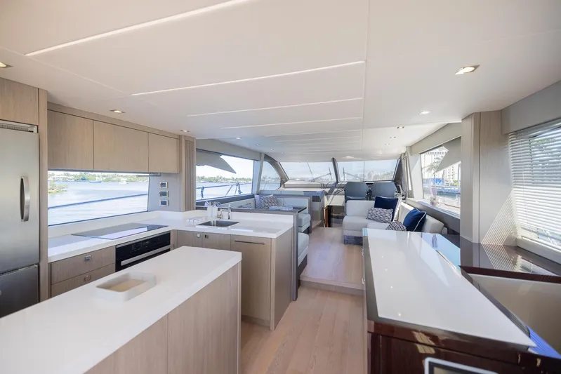 Sea Zar Yacht Photos Pics Luxurious interior of 2019 Sunseeker Manhattan 66 yacht with modern kitchen and spacious seating area.