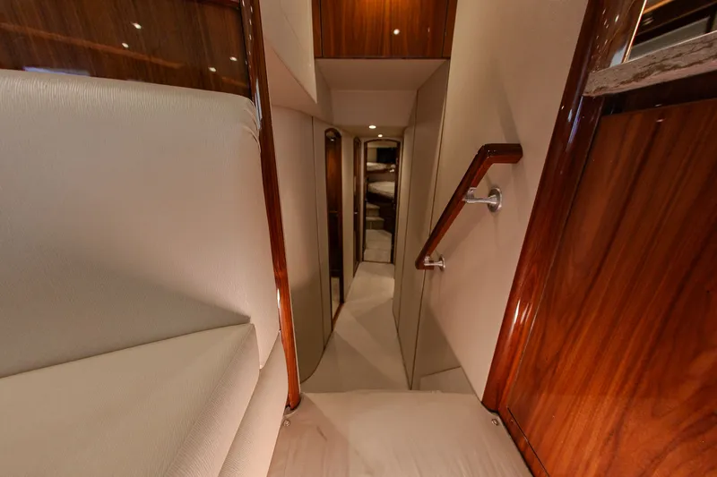  Yacht Photos Pics Interior of 2019 Viking 52 Convertible yacht with wood paneling.
