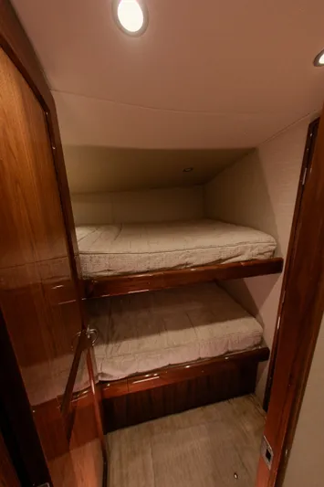  Yacht Photos Pics Interior of 2019 Viking 52 Convertible with bunk beds.