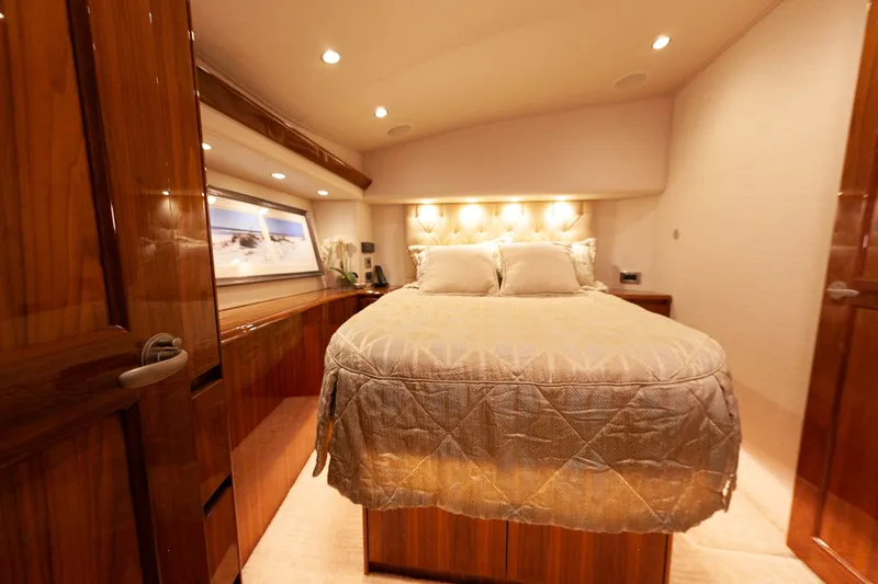  Yacht Photos Pics Luxurious bedroom in Viking 52 Convertible yacht, 2019 model.