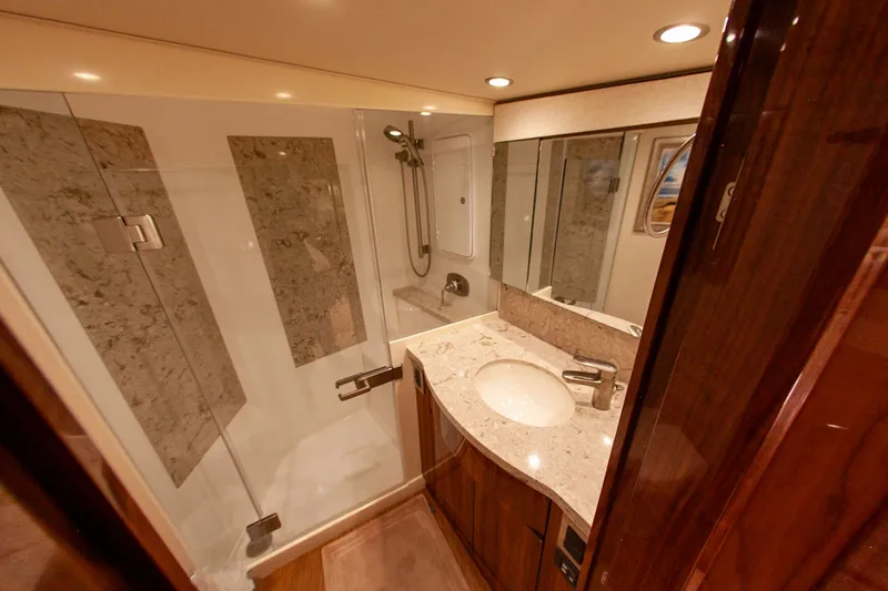  Yacht Photos Pics Luxurious bathroom in a 2019 Viking 52 Convertible boat.