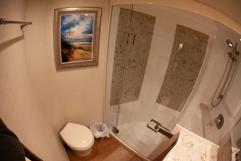  Yacht Photos Pics Bathroom in 2019 Viking 52 Convertible with shower and artwork.