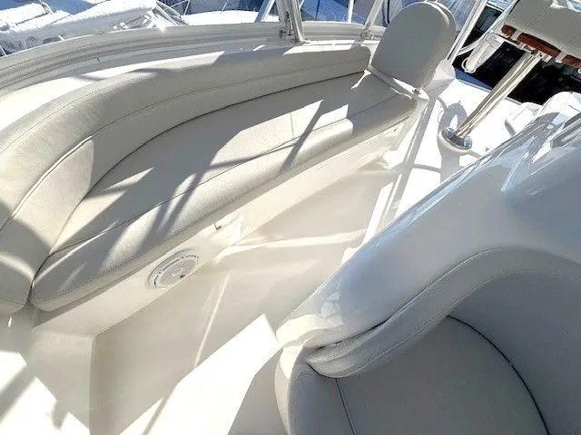  Yacht Photos Pics Interior of a 2019 Viking 52 Convertible yacht with white leather seating.