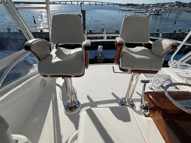  Yacht Photos Pics Two seats on a 2019 Viking 52 Convertible yacht.