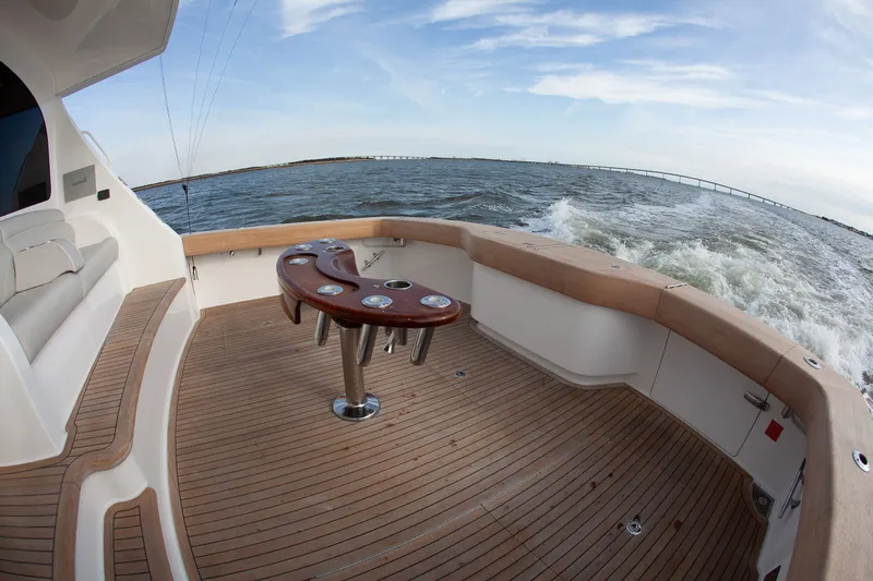  Yacht Photos Pics Viking 52 Convertible 2019 yacht with wooden deck on open sea.