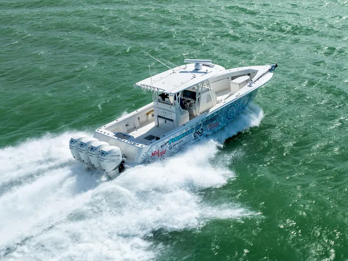  Yacht Photos Pics 2022 SeaVee 390Z boat speeding on open water, showcasing powerful engines.