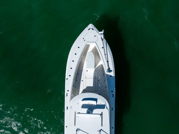  Yacht Photos Pics Aerial view of 2022 SeaVee 390Z boat on green water.
