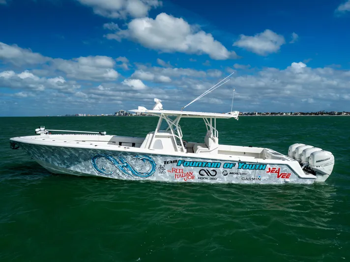  Yacht Photos Pics 2022 SeaVee 390Z boat on open water under a blue sky.