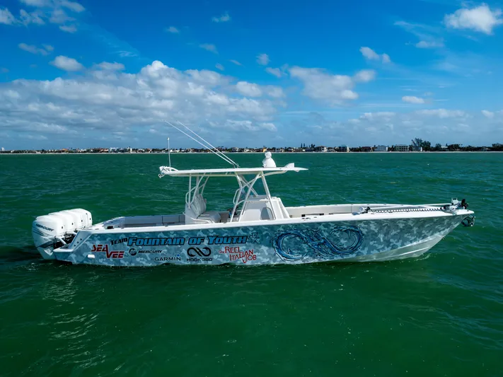  Yacht Photos Pics 2022 SeaVee 390Z boat on open water under blue sky.