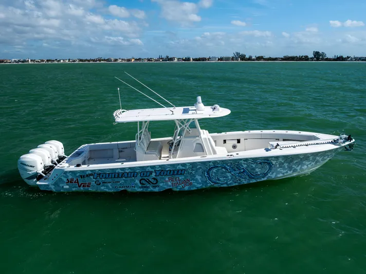  Yacht Photos Pics 2022 SeaVee 390Z boat on open water, featuring sleek design and multiple engines.