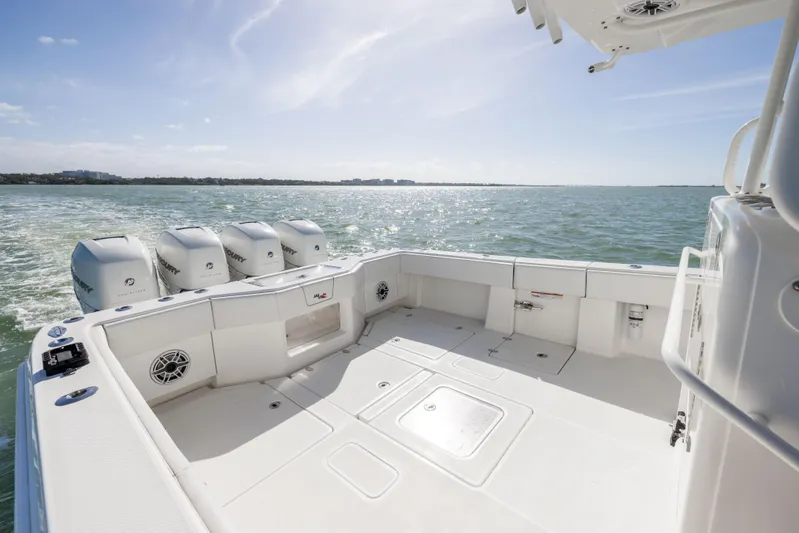  Yacht Photos Pics 2022 SeaVee 390Z boat deck with quad engines on open water.