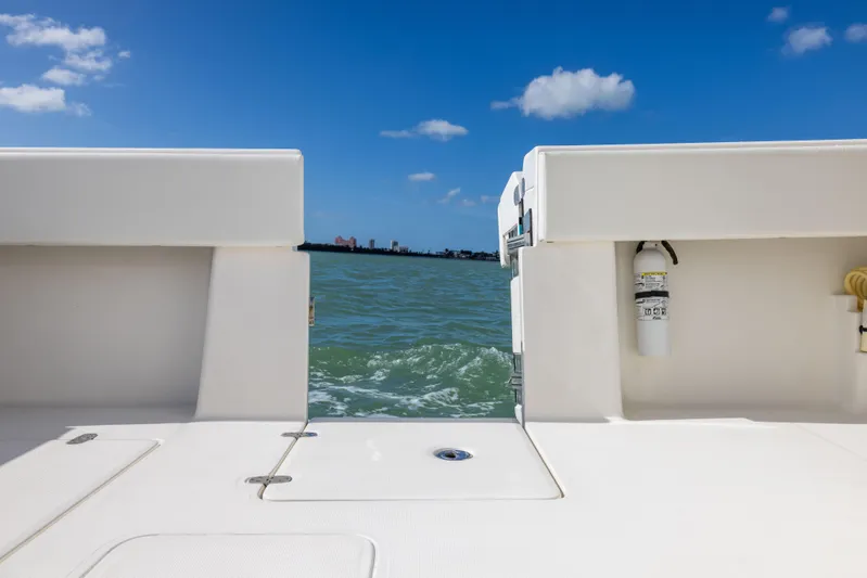  Yacht Photos Pics 2022 SeaVee 390Z boat deck with ocean view and clear blue sky.