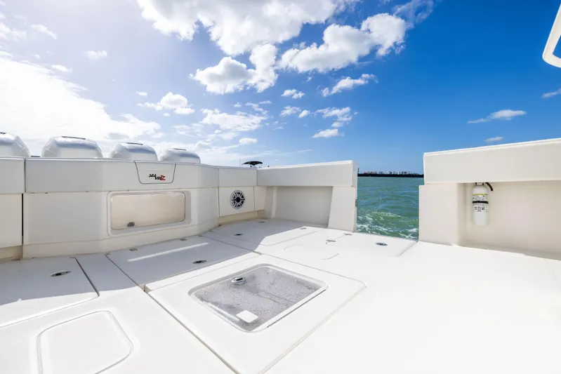  Yacht Photos Pics 2022 SeaVee 390Z boat deck with ocean view and blue sky.