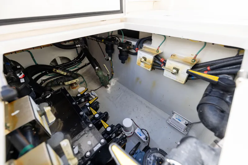  Yacht Photos Pics Engine compartment of 2022 SeaVee 390Z boat, showcasing mechanical components and wiring.