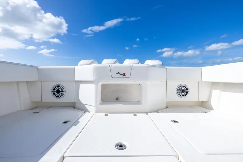  Yacht Photos Pics 2022 SeaVee 390Z boat deck with speakers under a clear blue sky.