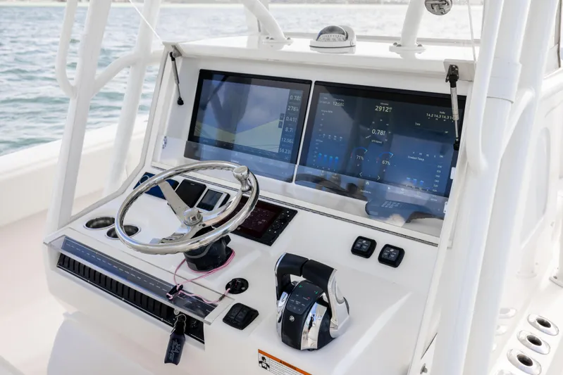  Yacht Photos Pics 2022 SeaVee 390Z boat dashboard with dual screens and steering wheel.