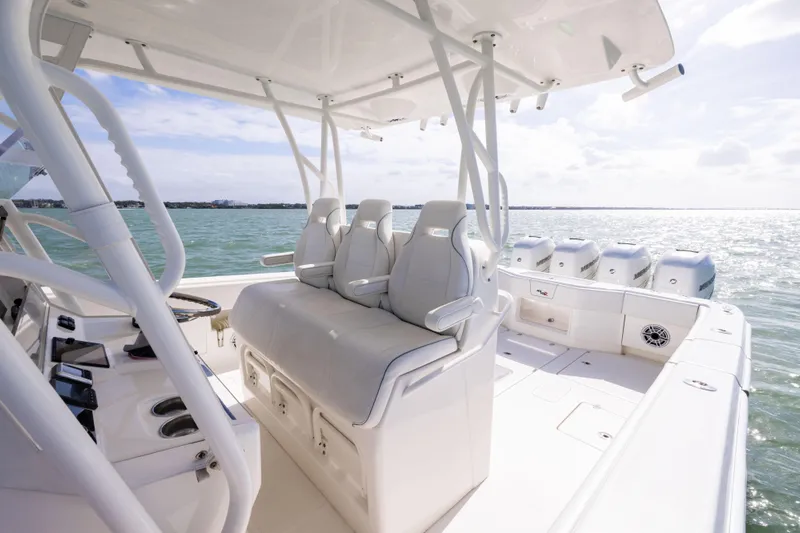  Yacht Photos Pics 2022 SeaVee 390Z boat interior with seating and ocean view.
