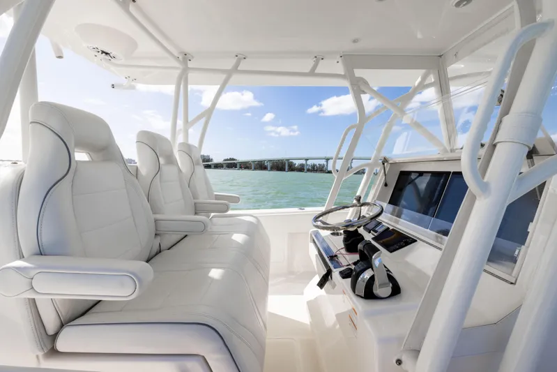  Yacht Photos Pics 2022 SeaVee 390Z boat interior with white seating and modern helm.