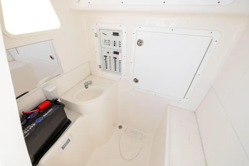  Yacht Photos Pics Interior of 2022 SeaVee 390Z boat with control panel and storage compartments.