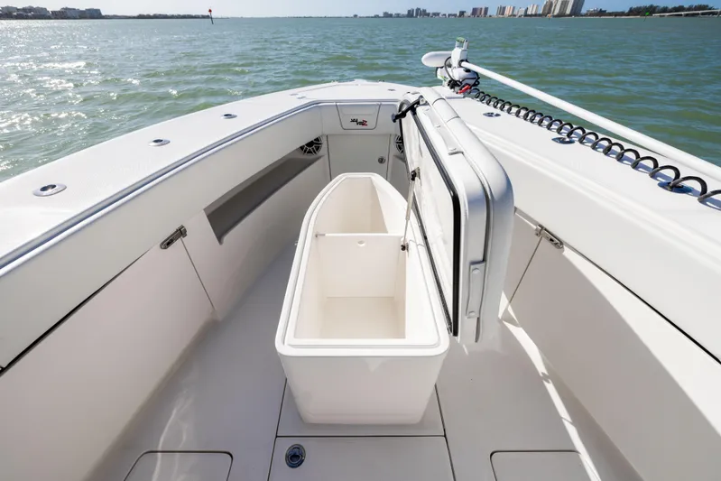  Yacht Photos Pics 2022 SeaVee 390Z boat interior with open storage compartment on calm water.
