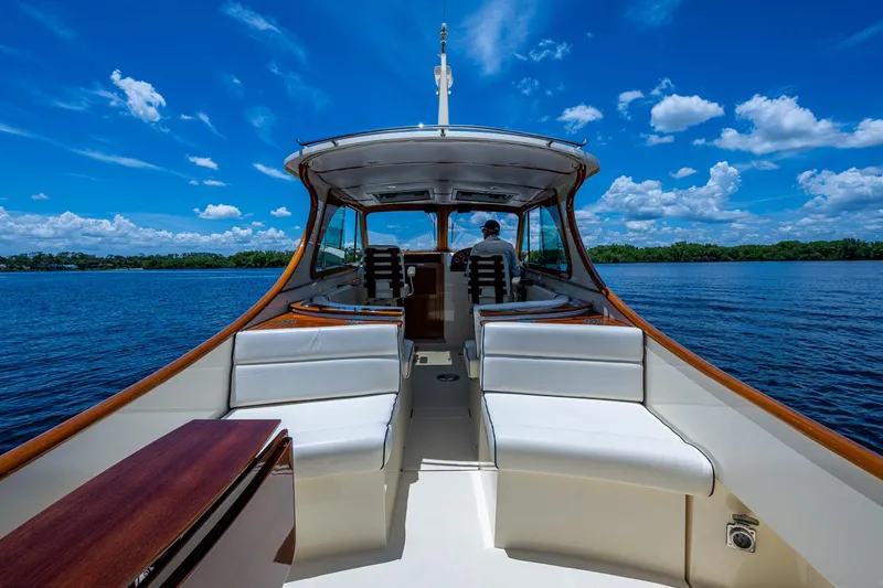 San Marco Yacht Photos Pics 2016 Hinckley Talaria 34 yacht cruising on a sunny day with clear blue skies.