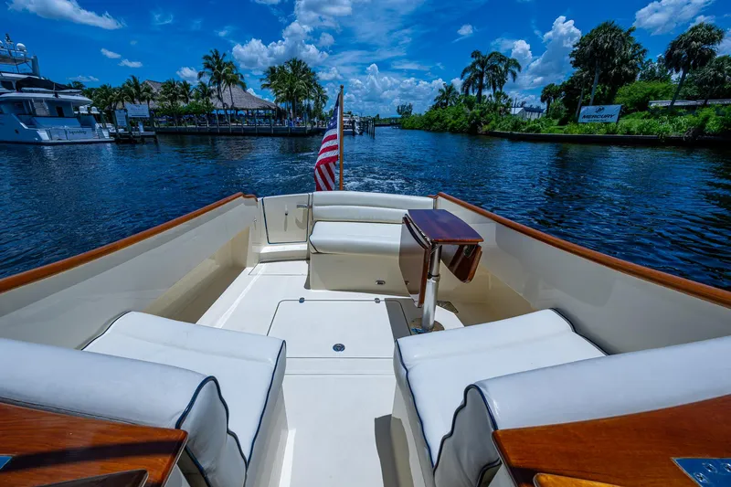 San Marco Yacht Photos Pics Hinckley Talaria 34 boat interior, 2016 model, cruising on a scenic waterway with palm trees.
