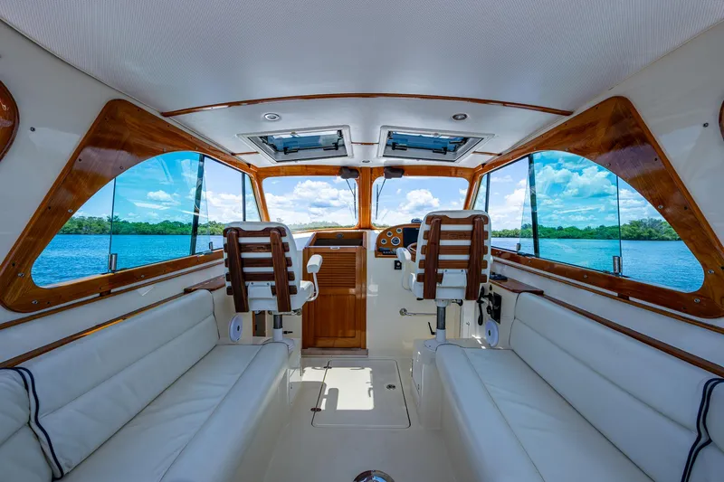 San Marco Yacht Photos Pics Interior of 2016 Hinckley Talaria 34 yacht with luxurious seating and scenic water view.