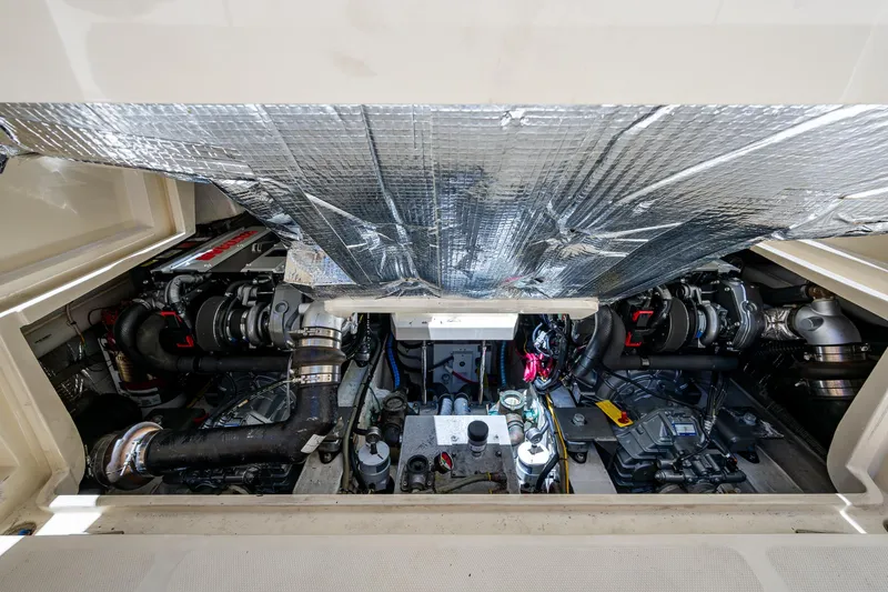 San Marco Yacht Photos Pics Engine compartment of a 2016 Hinckley Talaria 34 boat, showcasing mechanical components.