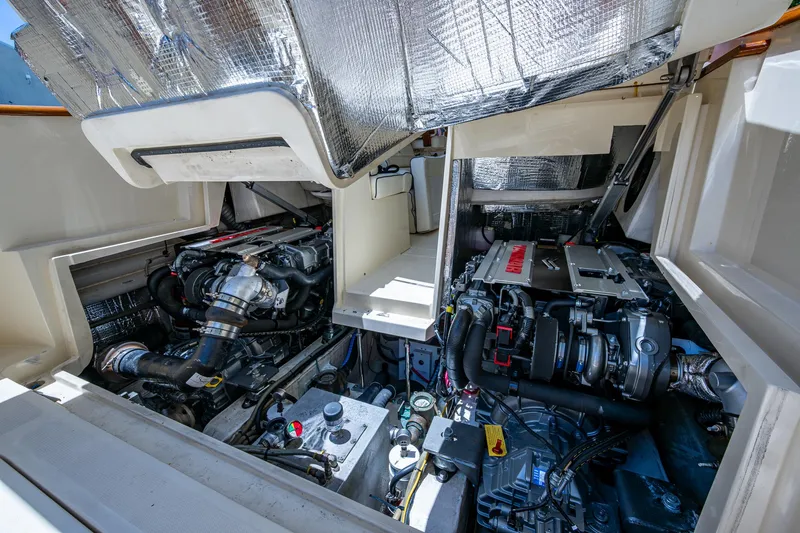 San Marco Yacht Photos Pics Engine compartment of a 2016 Hinckley Talaria 34, showcasing dual engines and components.