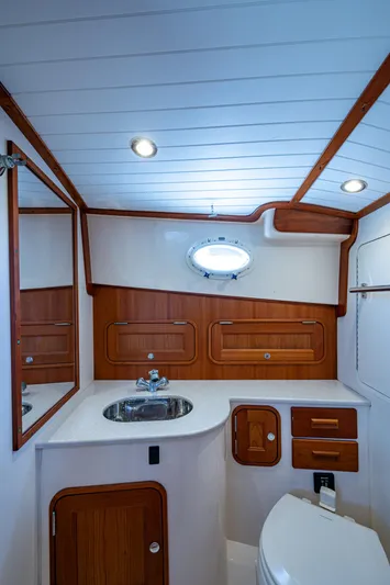 San Marco Yacht Photos Pics 2016 Hinckley Talaria 34 yacht bathroom with wood accents and modern fixtures.