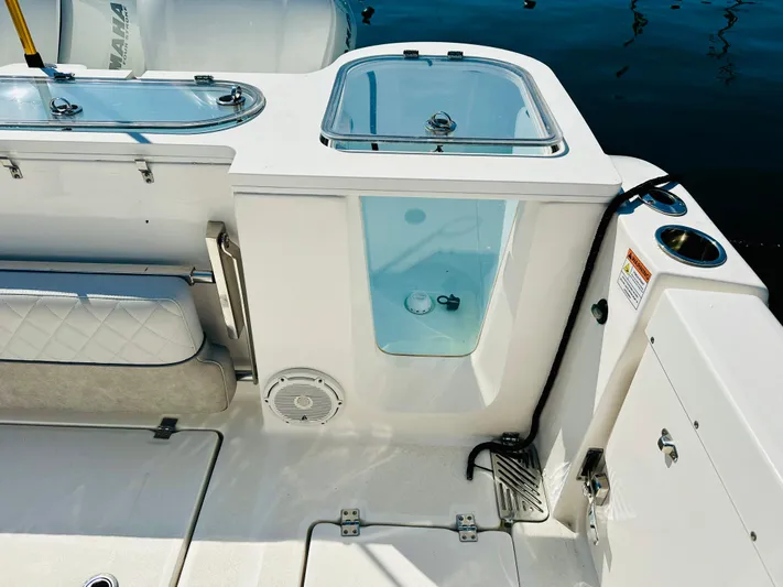  Yacht Photos Pics Sea Fox 328 Commander 2019 boat deck with storage compartments and seating.