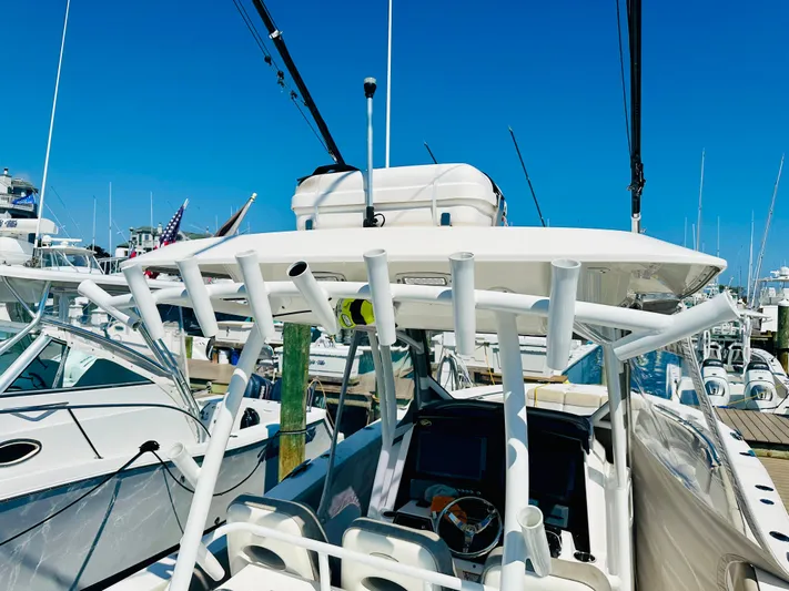  Yacht Photos Pics 2019 Sea Fox 328 Commander boat docked at marina under clear blue sky.