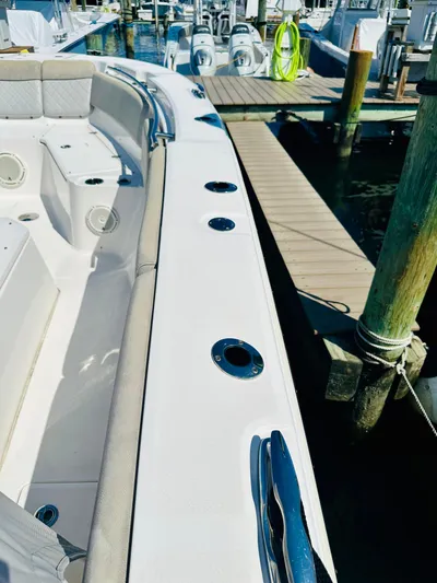  Yacht Photos Pics 2019 Sea Fox 328 Commander docked at marina, showcasing sleek design and spacious seating.