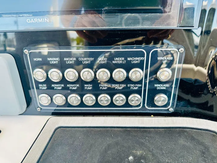  Yacht Photos Pics Control panel of a 2019 Sea Fox 328 Commander boat with labeled switches.