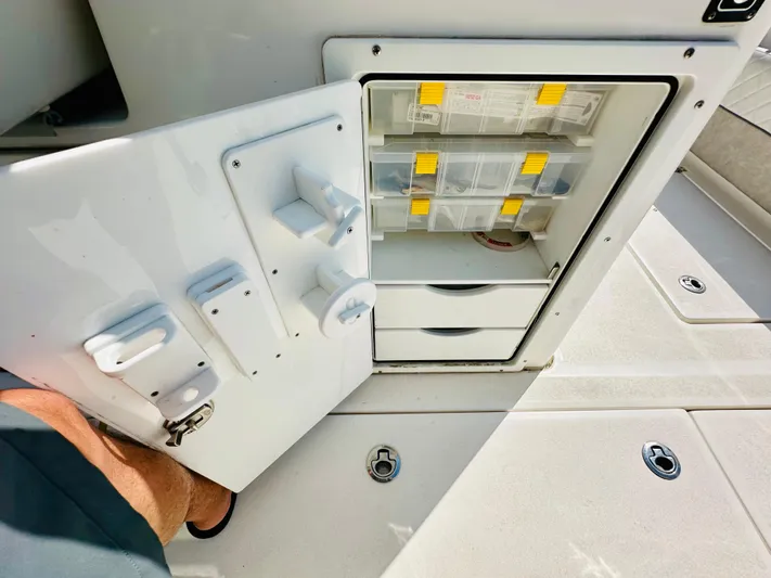  Yacht Photos Pics 2019 Sea Fox 328 Commander tackle storage with open door and organized compartments.