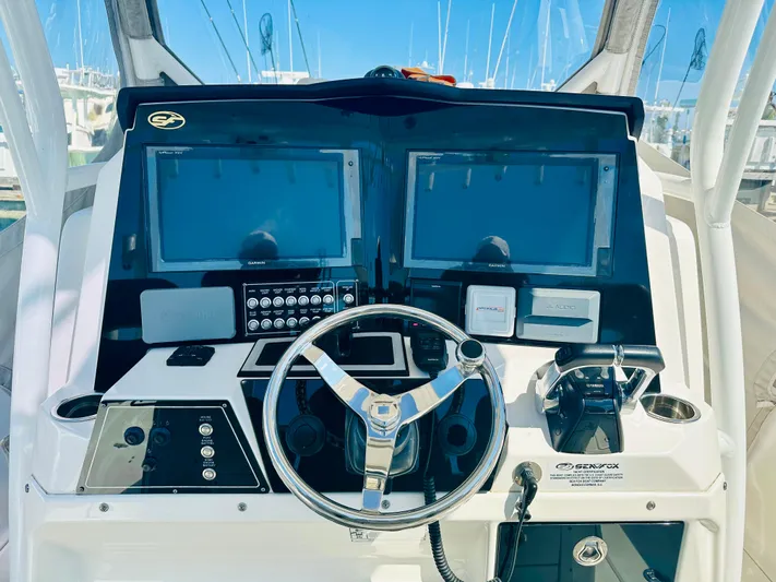  Yacht Photos Pics 2019 Sea Fox 328 Commander helm with dual displays and steering wheel.