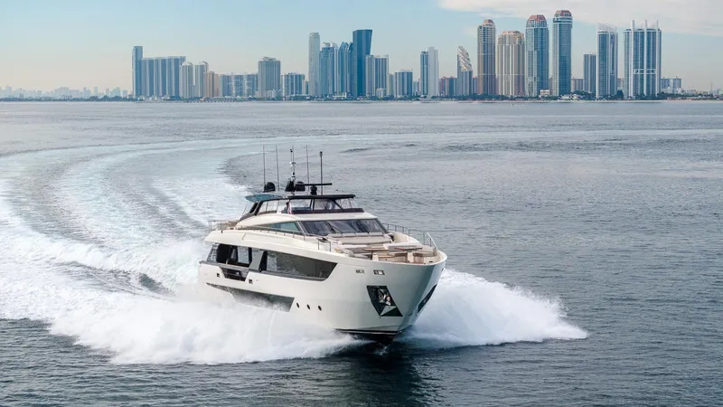 Aurora Yacht Photos Pics Ferretti Yachts 1000 cruising near city skyline, 2022 model.
