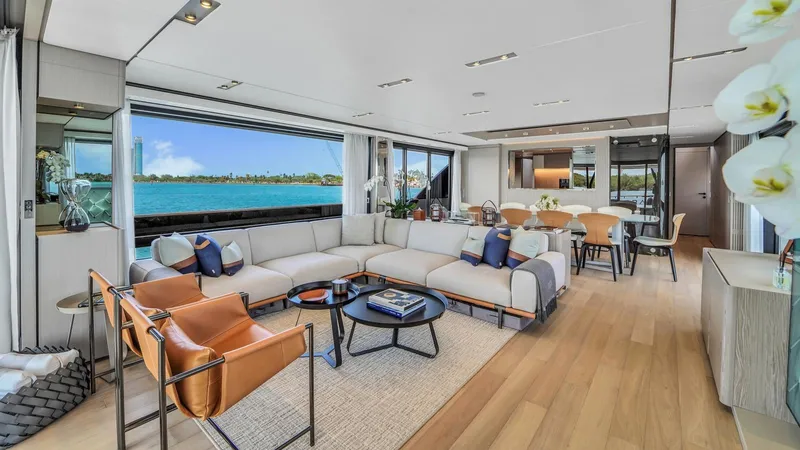 Aurora Yacht Photos Pics Luxurious interior of 2022 Ferretti Yachts 1000 with elegant seating and ocean view.