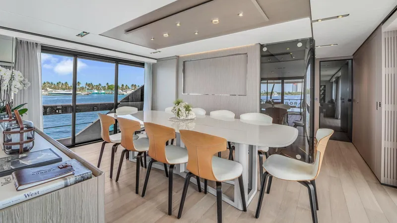 Aurora Yacht Photos Pics Luxurious dining area on 2022 Ferretti Yachts 1000, featuring elegant decor and ocean views.