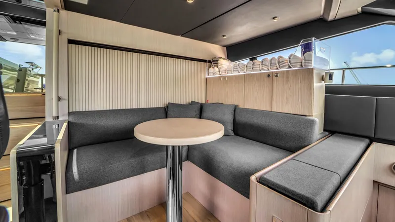 Aurora Yacht Photos Pics Luxurious interior of 2022 Ferretti Yachts 1000 with modern seating and elegant design.