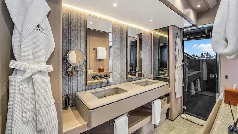 Aurora Yacht Photos Pics Luxurious bathroom interior of 2022 Ferretti Yachts 1000, featuring dual sinks and elegant design.