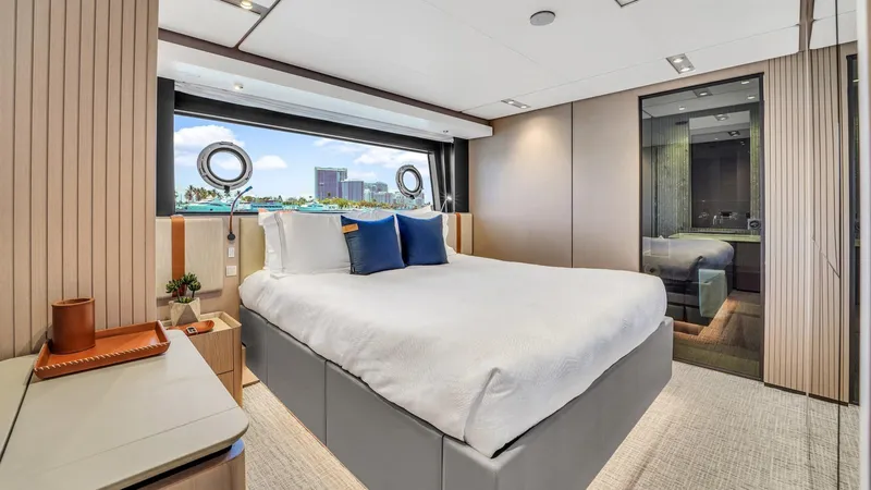 Aurora Yacht Photos Pics Luxurious bedroom interior of 2022 Ferretti Yachts 1000 with modern design and scenic window view.
