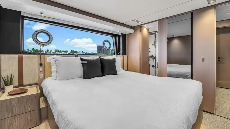 Aurora Yacht Photos Pics Luxurious bedroom interior of 2022 Ferretti Yachts 1000 with modern design and ocean view.