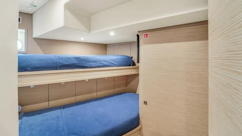 Aurora Yacht Photos Pics Interior of 2022 Ferretti Yachts 1000 with cozy bunk beds and modern design.