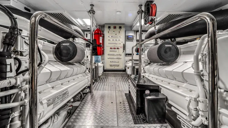 Aurora Yacht Photos Pics Engine room of 2022 Ferretti Yachts 1000, featuring dual engines and control panels.