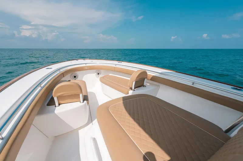  Yacht Photos Pics 2020 Valhalla Boatworks V-33 interior with tan seating, ocean view.