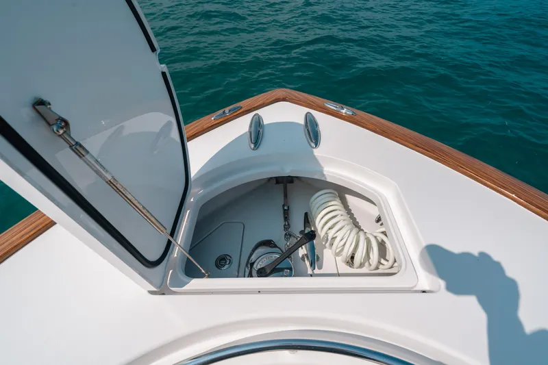  Yacht Photos Pics 2020 Valhalla Boatworks V-33 anchor locker with coiled rope, open hatch, and ocean view.