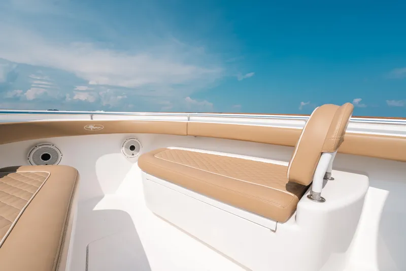  Yacht Photos Pics 2020 Valhalla Boatworks V-33 interior with tan seating under clear blue sky.