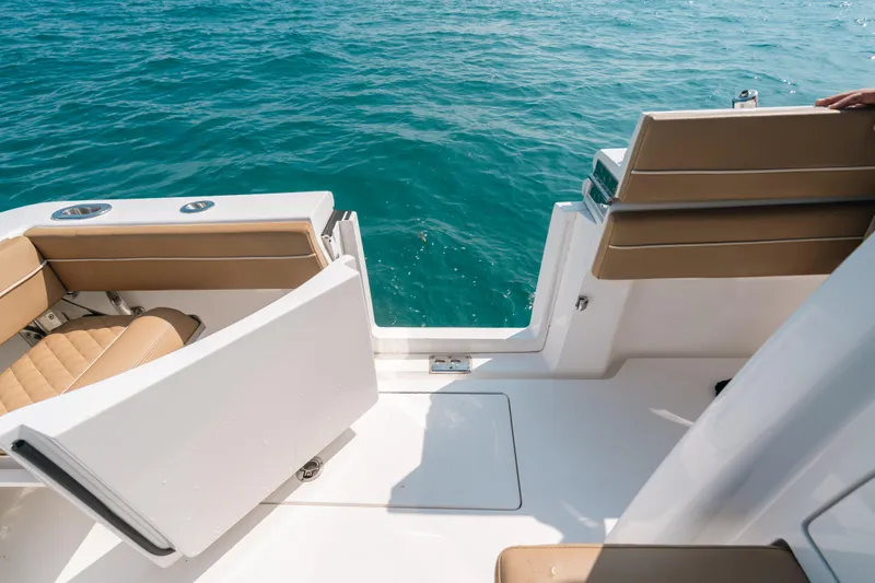  Yacht Photos Pics 2020 Valhalla Boatworks V-33 interior with tan seating, open door, and ocean view.